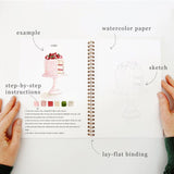Emily Lex Studio Watercolor Workbook - Baking

Twelve baking illustrations — a cupcake, layer cake, mixing bowl, lattice pie, tray of cookies, rolling pin with cookie cutters, and more — each pre-outlined with step-by-step instructions. Paintings take about thirty minutes from start to finish, making it approachable for first-time painters and a favorite for gifting.

12 beginner-friendly illustrations
Thick 120lb watercolor paper&nbsp;
Lay-flat pages with spiral binding for hassle-free painting and easy te
