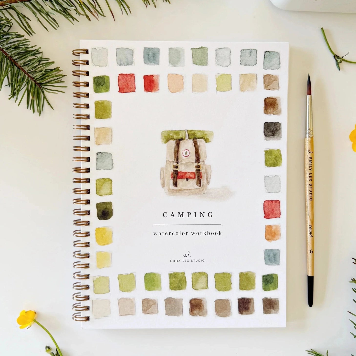 Twelve camping illustrations — a vintage camper, lantern, campfire, tent, canoe, s'mores, and more — each pre-outlined with step-by-step instructions. Paintings take about thirty minutes from start to finish, making it approachable for first-time painters and a favorite for gifting.