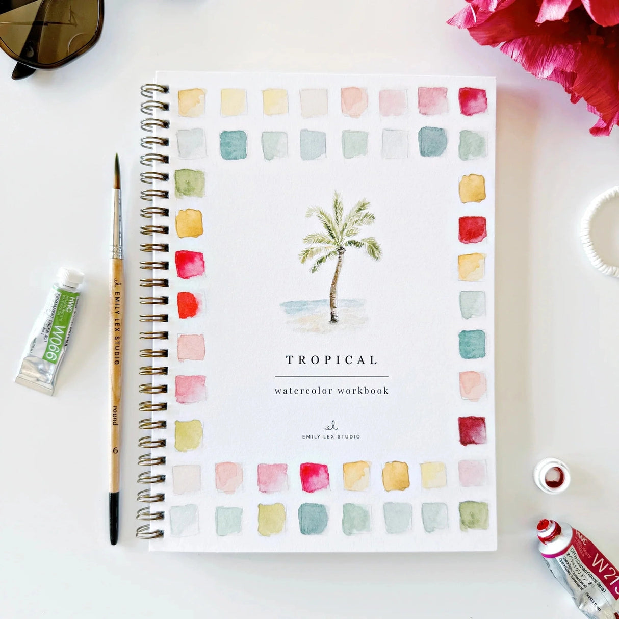 Emily Lex Studio Watercolor Workbook - Tropical

Twelve tropical illustrations — a palm tree, hibiscus, sea turtle, flamingo, pineapple, surfboards, and more — each pre-outlined with step-by-step instructions. Paintings take about thirty minutes from start to finish, making it approachable for first-time painters and a favorite for gifting.

12 beginner-friendly illustrations
Thick 120lb watercolor paper&nbsp;
Lay-flat pages with spiral binding for hassle-free painting and easy tear-out&nbsp;
Lightly outlin