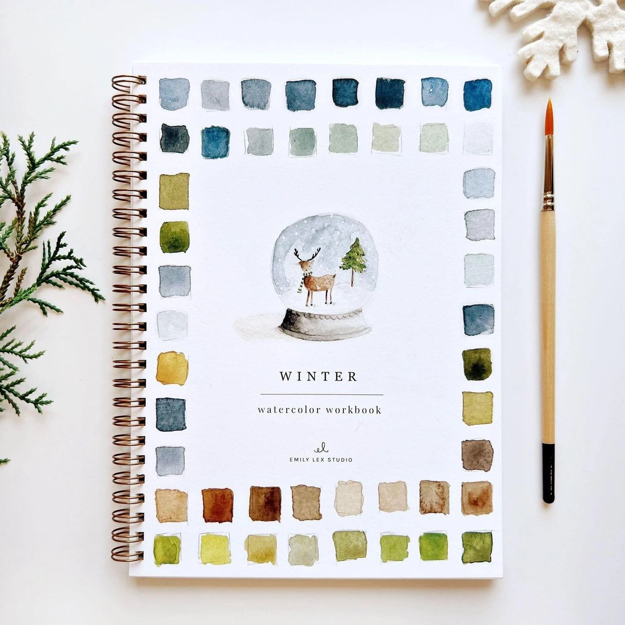 Twelve winter illustrations — a snowman, A-frame cabin, fair isle sweater, snow globe, ice skaters, mittens, and more — each pre-outlined with step-by-step instructions. Paintings take about thirty minutes from start to finish, making it approachable for first-time painters and a favorite for gifting.