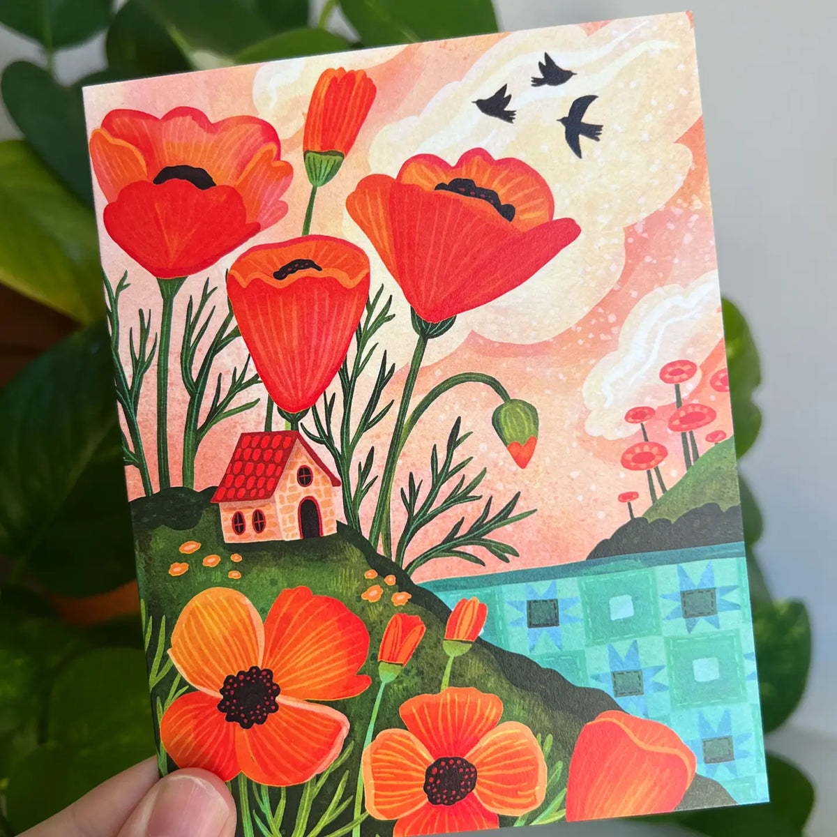 Emmylou Illustrations - Orange Poppy Cottage Greeting Card

Spring or Summer greeting card featuring colorful orange poppies, cozy cottage, and a quilted lake/ocean. Perfect for anniversaries, birthdays, Mother’s Day, housewarming, or just because! All greeting cards are hand illustrated by me!&nbsp;

Printed on premium heavyweight matte cardstock, this A2 card is blank inside—ready for your handwritten notes.

Includes a kraft envelope