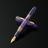 Esterbrook x Sakuradragon Sakura Street Estie Fountain Pen

Created with artist Cindy Duong of Sakuradragon, the Sakura Street Estie brings her imaginative illustrated world to Esterbrook's traditional Estie fountain pen. Its U.S.-blended material combines translucent purple with colorful glitter sparkle, while the custom clip is etched with Cindy's Sakura pattern. Dual Esterbrook and Sakuradragon engraving and a gold-plated converter finish the design. Each pen arrives in special packaging with Japanese gi