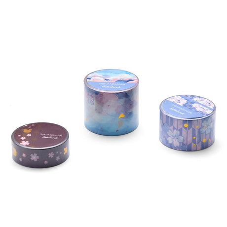 Esterbrook x Sakuradragon Washi Tape - Sky

The Sky Washi Tape turns Cindy Duong's Sakura Street Sky illustration into a continuous scene. Soft clouds and rooftops fill the 3.5 cm-wide tape, with gold foil details appearing throughout the design. Each roll contains five meters for decorating journals, letters, and stationery projects.&nbsp;