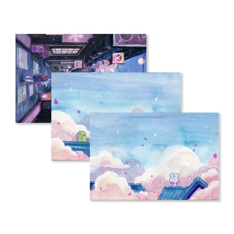 Send a note from Sakura Street with this set of three premium postcards featuring Cindy Duong's original illustrations. The set includes the Dino Sky, Dino Sakura, and Sakura Street designs, each printed on heavyweight cardstock. A custom address layout on the reverse adds more of the collection's playful artwork to every piece of correspondence.