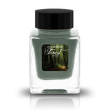 Forbidden Forest Shimmer captures the magic of a woodland few dare to enter. Deep teal and blue-green pools weave through soft mossy undertones, while a luminous champagne-gold shimmer dances across the page like sunlight filtering through an ancient canopy. Rich bronze shading emerges in heavier swabs, creating depth and intrigue with every stroke. Mysterious yet inviting, this ink evokes winding forest paths, hidden clearings, and treasures waiting to be discovered beneath the leaves.