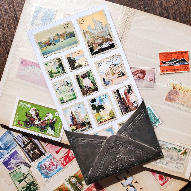 🏙🗽 Explore vintage NYC through these dreamy watercolor sticker stamps by artist Rachael Robinson Elmer. From snow-dusted Washington Square to sun-drenched harbor views, it’s a love letter to the Big Apple, one postage stamp at a time.