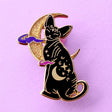 Cute, cuddly and clever – there’s no cat quite like a Sphynx! This fab enamel pin features a black Sphynx covered in mystical symbols, sitting in front of a crescent moon with 2 purple clouds.

The pin is 42mm (1.65”) tall, and is made from gunmetal hard enamel, with glitter and UV printed details. It's secured with 2 pink clutches to keep the pin in place.