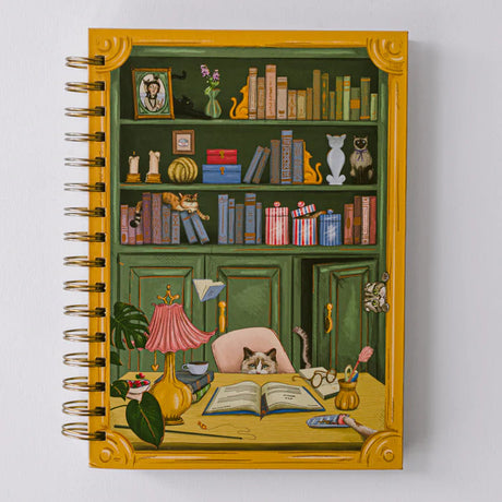 For cat lovers, book lovers, and anyone who believes planning should be delightful, the Cat Library Undated Weekly Planner brings a playful twist to everyday organization. The cover features a vintage-inspired library scene where curious cats lounge, climb, and quietly cause chaos among the shelves. Finished with gold foil details and gold wire binding, this planner feels whimsical yet polished.