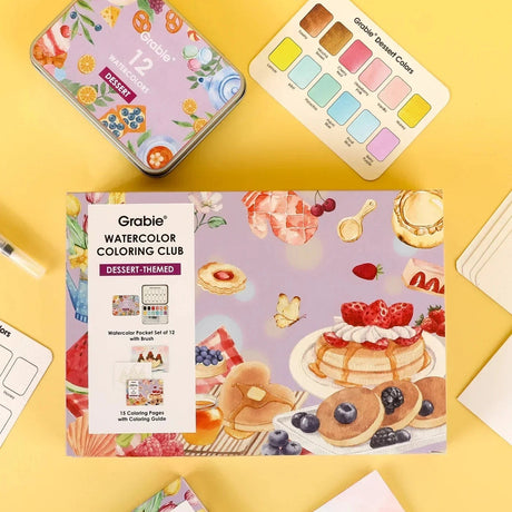 INDULGE YOUR CREATIVITY
Treat yourself to the sweetest watercolor adventure and build a colorful haven for your imagination. This delightful bundle comes with our custom 12-color Dessert palette and a whimsical coloring book featuring 15 pages of mouth-watering treats—from stacked pancakes and boba tea to elegant tiered cakes and delicate macarons. Bring these cozy, bakery-inspired scenes to life and watch your skills flourish!

A SWEET SETTING FOR CREATIVE ARTISTS
Embark on a delicious creative journey wit