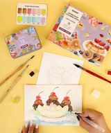INDULGE YOUR CREATIVITY
Treat yourself to the sweetest watercolor adventure and build a colorful haven for your imagination. This delightful bundle comes with our custom 12-color Dessert palette and a whimsical coloring book featuring 15 pages of mouth-watering treats—from stacked pancakes and boba tea to elegant tiered cakes and delicate macarons. Bring these cozy, bakery-inspired scenes to life and watch your skills flourish!

A SWEET SETTING FOR CREATIVE ARTISTS
Embark on a delicious creative journey wit