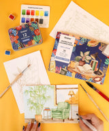 IDEAL SETTING FOR VERSATILE ARTISTS
Embark on a practical creative adventure with our meticulously curated Essential-Themed watercolor gift set. This collection features a watercolor pocket set boasting 12 essential hues, each chosen to reflect the versatility needed for all subjects—from still life to simple landscapes. Accompanied by an intricately illustrated 15-sheet watercolor coloring book, focused on daily essentials and core techniques, this ensemble invites you to explore the fundamentals of waterc