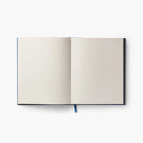 Our embroidered sketchbook is a large, hardcover journal with 108 unlined pages, perfect for sketching, drawing, and journaling. The cover is wrapped in blue book cloth and embroidered with our Gracie florals. Inside, an attached grosgrain ribbon bookmark will save your place.