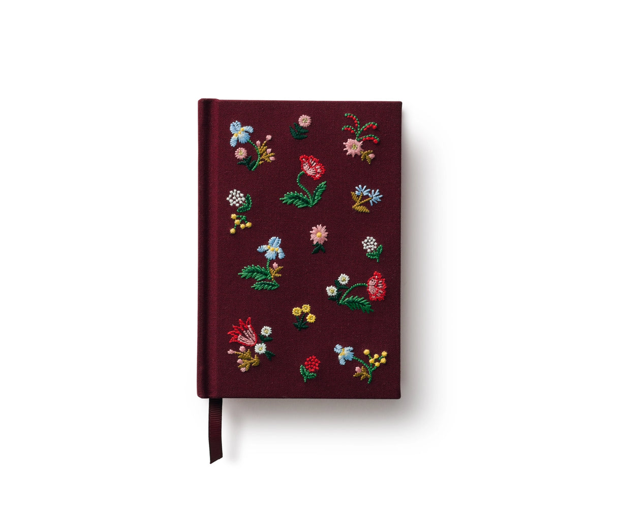 A mini hardcover journal, embroidered with delicate Gracie blooms and gold accents. Inside, find 240 blank, unlined pages and a ribbon bookmark.