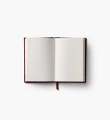 A mini hardcover journal, embroidered with delicate Gracie blooms and gold accents. Inside, find 240 blank, unlined pages and a ribbon bookmark.