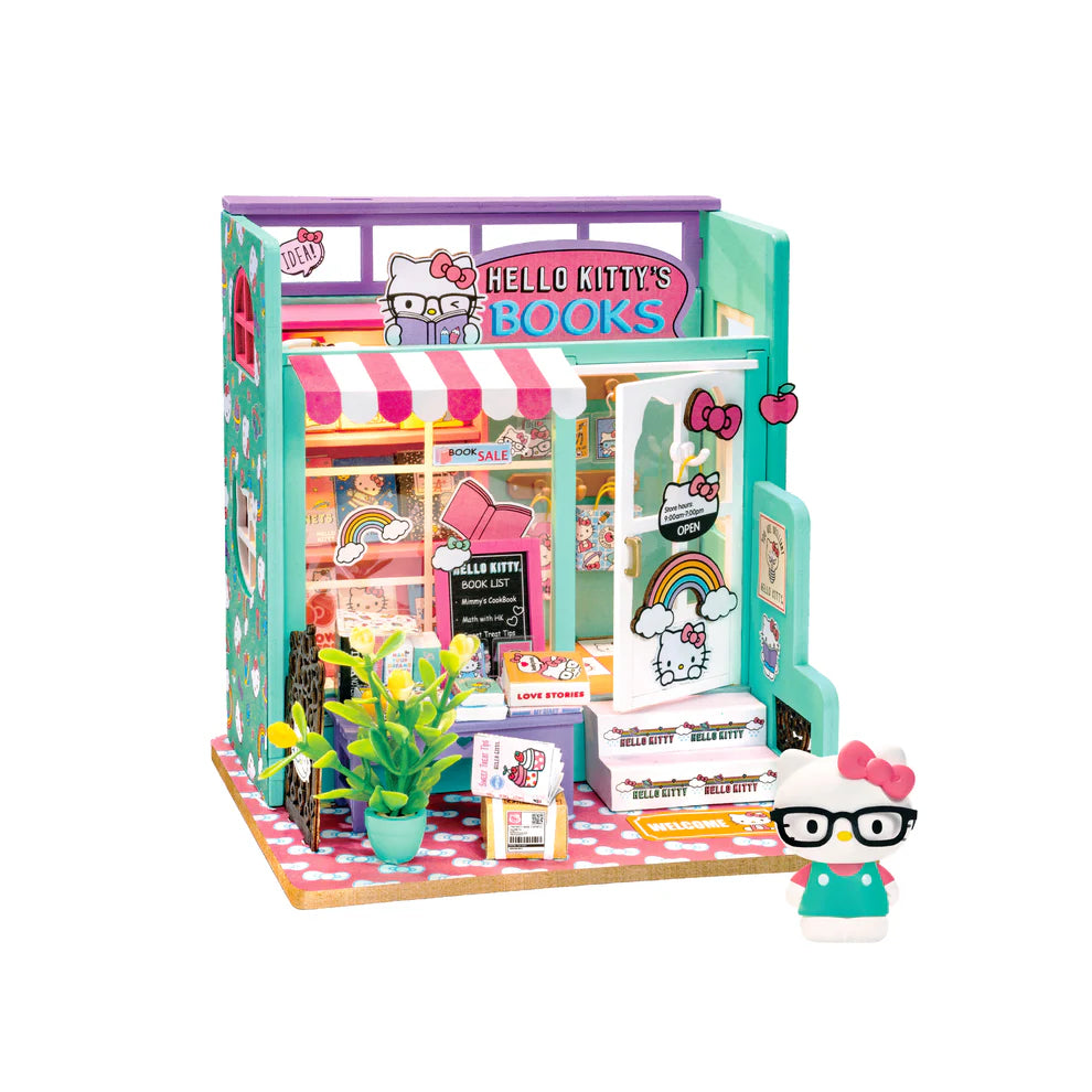 Step into the charming world of Hello Kitty with this delightful miniature house kit, where she runs her very own bookstore. Filled with tiny books, adorable gifts, and colorful gift bags, this kit is decorated in Hello Kitty's iconic style. The charming "open" sign welcomes you into the cozy shop, where a little lamp lights up the interior, creating a warm and inviting atmosphere. Perfect for fans and crafters alike, this kit offers hours of fun and a beautiful keepsake to treasure.