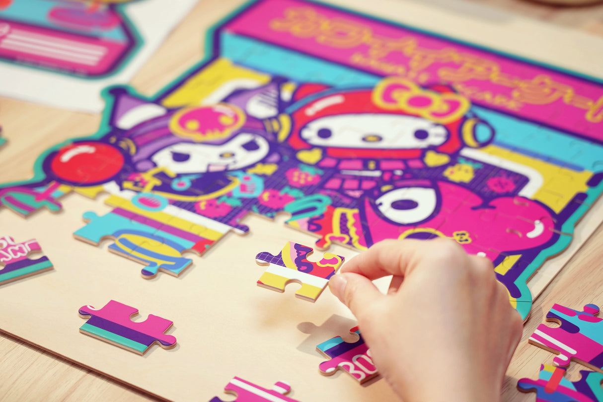Discover joy with the Hello Kitty Wooden Jigsaw Puzzle: Kawaii Arcade (99pcs). This officially licensed Sanrio product features iconic Hello Kitty in 96 vibrant wooden pieces. Crafted for durability and a seamless fit, it's a delightful challenge for fans of all ages 8+. Embrace positivity and bring Hello Kitty to life with this charming puzzle – perfect for relaxation and family fun. Display your completed masterpiece proudly and celebrate the timeless appeal of Hello Kitty.