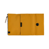 Its standout feature is the generously sized pocket, but its overall appearance remains clean and minimal. The vibrant yet subdued mustard color gives it a beautiful finish that suits anyone, regardless of style. Though it folds into thirds and fastens with a magnetic closure, the cover is light in hand. The aim was effortless elegance, something that looks sharp without being flashy. The material is a soft nylon with a sophisticated sheen.
