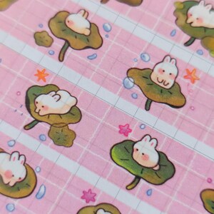 Add a touch of sweetness to your crafts with our Lotus Bunny washi tape! Perfect for journaling, scrapbooking, decorating, and more, its soft, whimsical design brings gentle charm to every project!