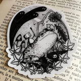 Sticker featuring a little robot and his faithful frog companion making their way through the haunted graveyard, from original pen and ink artwork by Jon Turner.