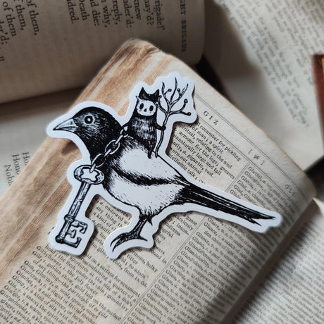Die-cut vinyl sticker featuring a little spirit riding his noble magpie steed, the keepers of a mysterious key. Design taking from an original ink drawing by Jon Turner.