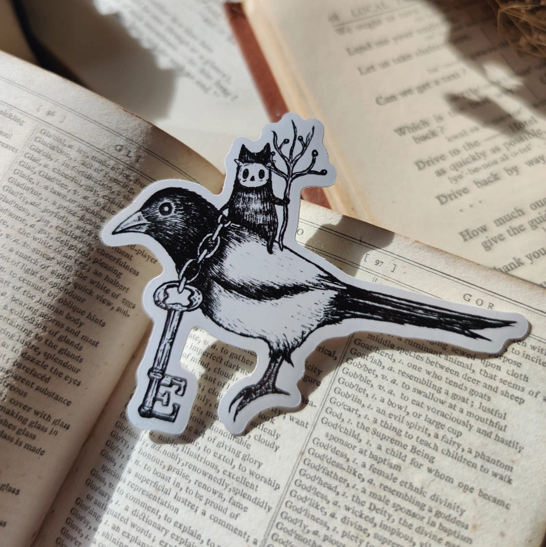 Die-cut vinyl sticker featuring a little spirit riding his noble magpie steed, the keepers of a mysterious key. Design taking from an original ink drawing by Jon Turner.
