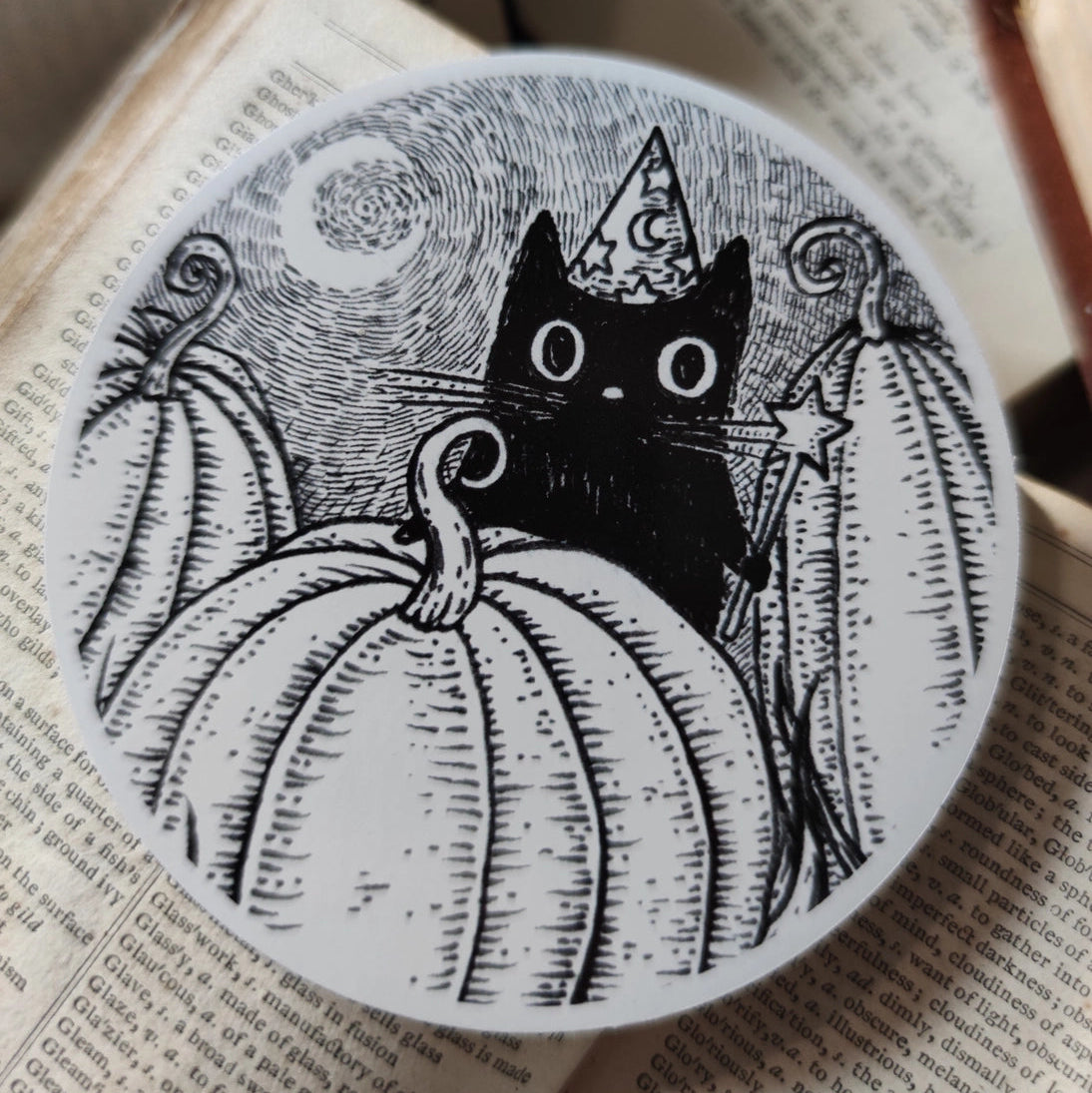 Simon's in the pumpkin patch again! A little magical black cat on a lovely die-cut vinyl sticker, from original pen and ink artwork by Jon Turner.