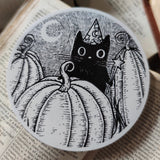 Simon's in the pumpkin patch again! A little magical black cat on a lovely die-cut vinyl sticker, from original pen and ink artwork by Jon Turner.