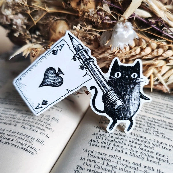 A little sticker based on my friend Simon the black cat, flying his Ace flag, from my original pen and ink artwork.