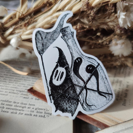 Die-cut vinyl sticker featuring a little bottle-backed ghost hunter, taken from Jon Turner's book Fragments.