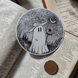 A little Van Gogh-inspired ghostie holding a sunflower beneath a starry night sky, from an original ink drawing by Jon Turner.