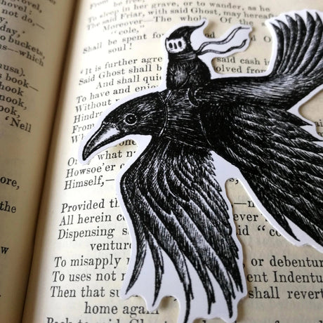 A sticker featuring a little spirit soaring high on the back of a crow, from original pen and ink artwork by Jon Turner.

Die-cut vinyl sticker, suitable for interior or exterior use. Measures approximately 9.5cm (3.75 inches) diameter. Supplied unpackaged