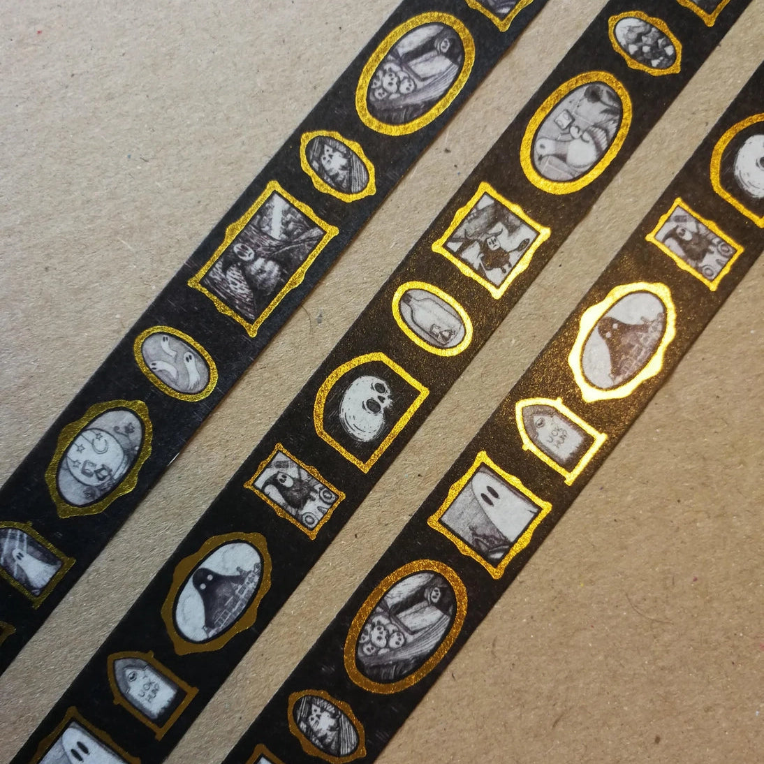 Turn every surface into a tiny gallery with this washi tape featuring tiny Jon Turner artworks in shiny gold frames, an array of little robots, ghosts and other spooky oddities. Perfect for spooky journalling or curious correspondence.

Two designs available, with each tape featuring 16 miniature masterpieces in a repeating pattern. Each roll measures approximately 15mm wide, and the roll is 10m long; they are cello wrapped and decorated with branded stickers on either side.



15mm wide
10m length