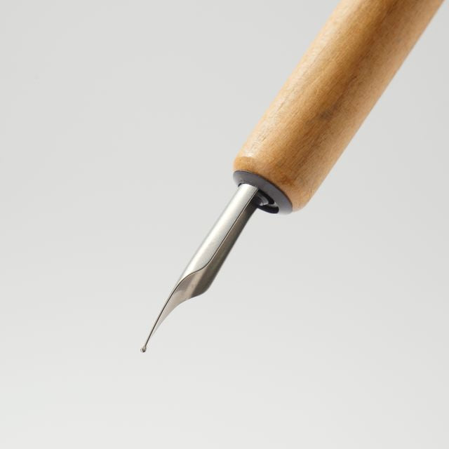 Enjoy the smooth writing feel of a fountain pen in a maintenance-free nib. When you’re done writing, simply rinse with water and dry. An ideal first nib for those new to bottled ink.

The nib is carefully aligned by hand to achieve superior ink retention, allowing about a sentence of writing with each dip. Developed specially for writing, the design replicates the form of the fountain pen nib, while rigorous testing ensures the nib won't catch on paper.

Stainless steel, iridium (nib point)

Use and Care:

