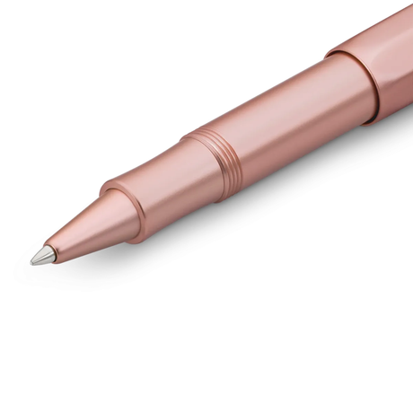 Kaweco AL SPORT Roller Ball - Rose Gold

Contemporary design made of high-quality aluminium for an incomparable writing feel.
It is impossible to imagine the current fashion or even lifestyle products without it: we’re talking about the colour rosé gold. The AL Sport roller ball in this slightly pink nuance with its silky surface appears delicate and discreet.

The metallic body is made of high-quality aluminium and grants an unique haptic experience. Its fine surface imparts elegance.