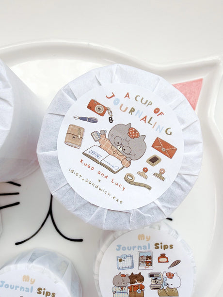 A Cup of Journaling P.E.T Tape, a collaboration with Idiot Sandwich

Add a touch of seasonal whimsy to your creative projects with Our first collaboration with Idiot Sandwich, an Illustrator from Vietnam. Thao illustrations captures everything Kubo and Lucy is about, coffee, stationery and journaling. This P.E.T tape is perfectly Kiss Cut, for easy use.