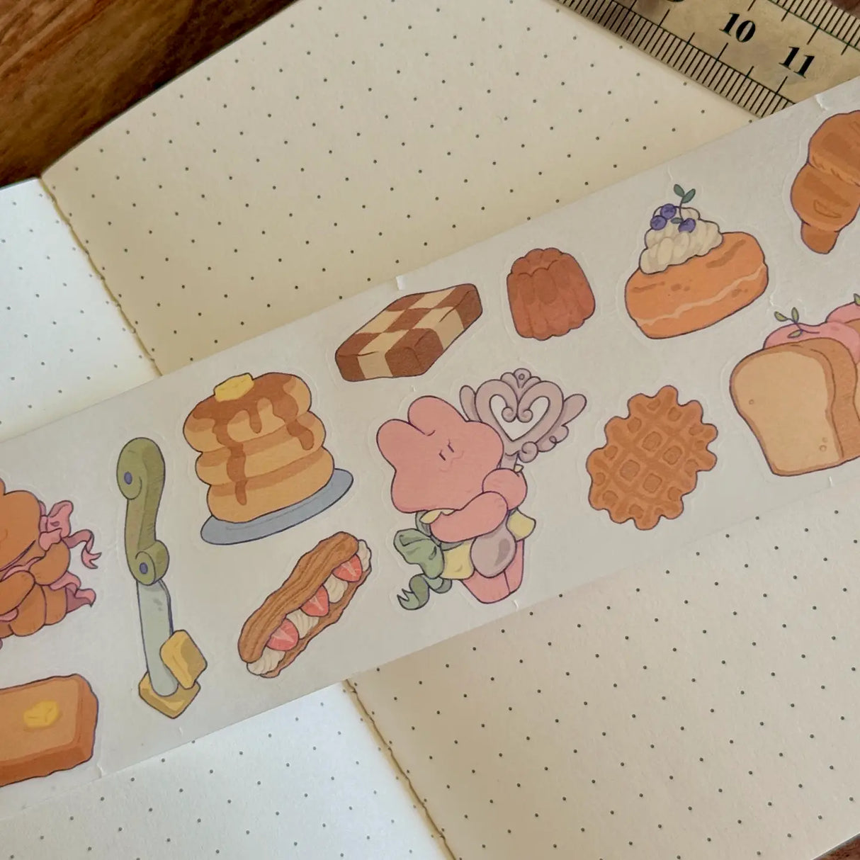 5 meters of pure kiss-cut, washi sticker bakery bliss~

They readjust easily and blend in with the paper. (Lighter paper recommended for maximum visibility)

Just like the washi tape material you love, but in a sticker roll. No more saving your stickers for later! Use it up!!

Dimensions: 50mm x 5m