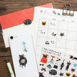 A sticker featuring a stylish black cat named 'Robin-chan' as the main character.
Robin-chan's pose, which gives off the unique softness of cats, is irresistibly cute.


Printed on PET material, the stickers have a smooth, durable finish that’s easy to peel and place - great for both everyday use and special projects.

✨ Product Details

Smooth, durable PET sticker material
Perfect for planners, journals, scrapbooking, and cardmaking
Backing Sheet Size: 141 × 188 mm
Sticker sheet size: 138 × 170 mm