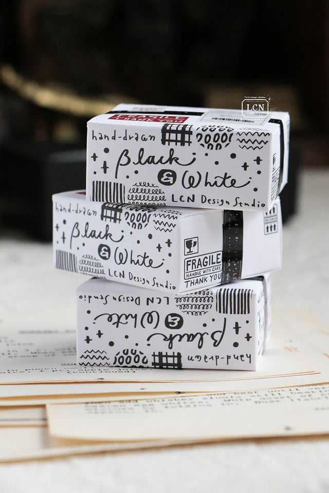 A mini package box full of black and white stickers!
How cute is that!
It has everything: a fragile sticker, shipping label, and even an invoice!
That invoice is also a sticker!