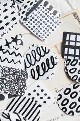 A mini package box full of black and white stickers!
How cute is that!
It has everything: a fragile sticker, shipping label, and even an invoice!
That invoice is also a sticker!
