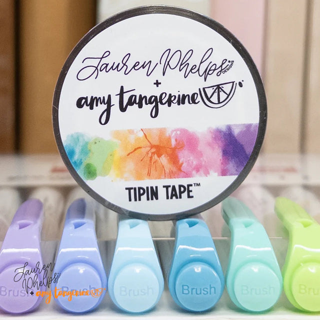 Do you love adding interactive elements to your scrapbook layouts like photos, journaling cards, patterned paper, ephemera, and keepsakes, but want a clean, professional way to attach them without bulky adhesives or visible hinges?

Tip In Tape™ was designed for exactly that.

Tip In Tape™ is a clear matte PET tape created for adding interactive elements to scrapbook pages and paper crafting projects with precision and ease. It allows you to create flip-ups, tip-ins, layered details, and movable elements wh