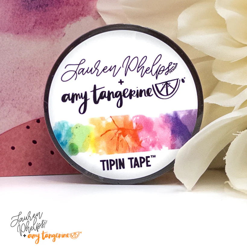 Do you love adding interactive elements to your scrapbook layouts like photos, journaling cards, patterned paper, ephemera, and keepsakes, but want a clean, professional way to attach them without bulky adhesives or visible hinges?

Tip In Tape™ was designed for exactly that.

Tip In Tape™ is a clear matte PET tape created for adding interactive elements to scrapbook pages and paper crafting projects with precision and ease. It allows you to create flip-ups, tip-ins, layered details, and movable elements wh