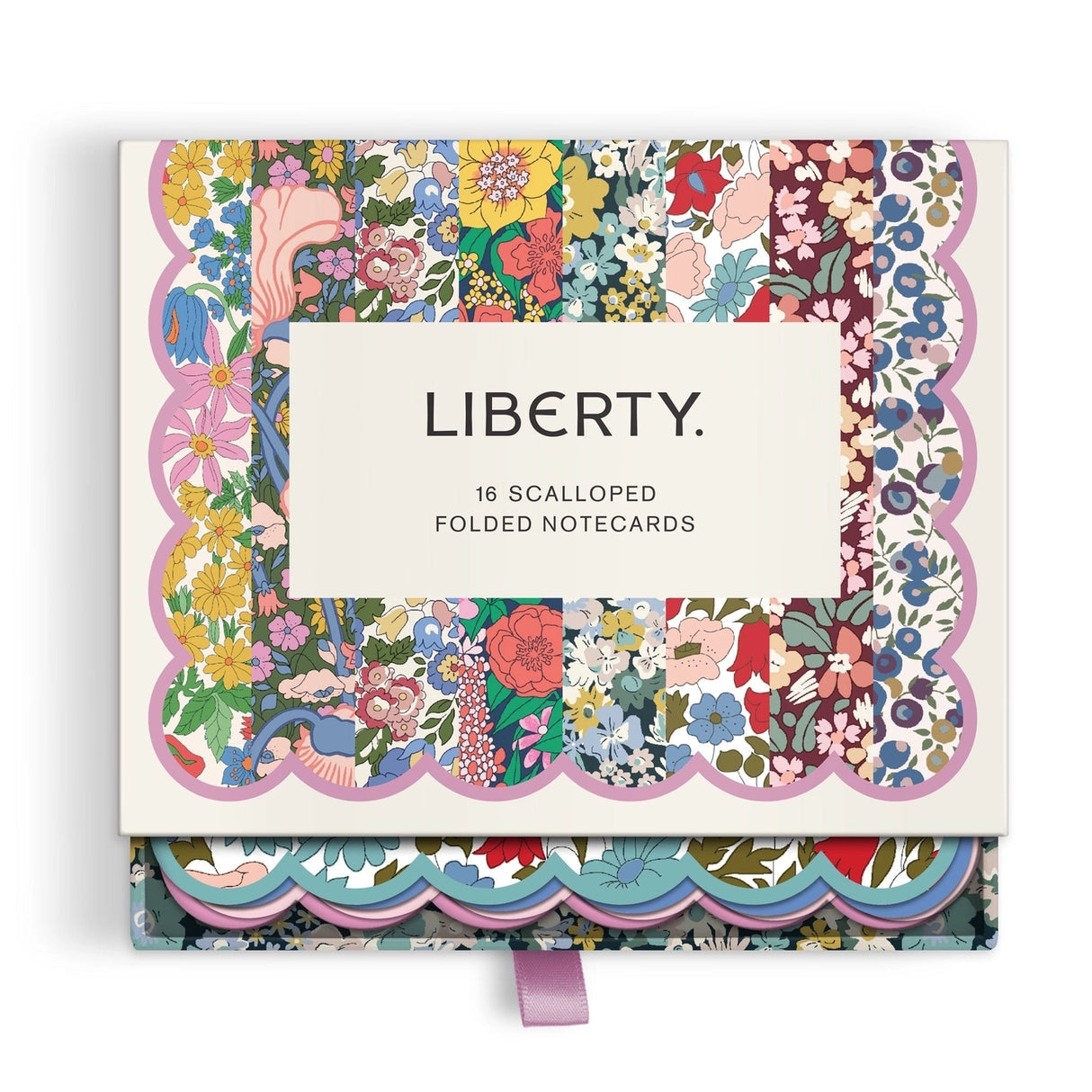 Elevate your correspondence with the Liberty Premium Notecard Set. This elegant collection features 16 folded notecards showcasing 8 distinctive iconic Liberty London designs. Each card is finished with delicate die-cut scalloped edges that add a refined touch to every note you send. The set includes full-color envelopes lined with charming floral patterns, bringing beauty to every detail. Presented in a premium drawer box with a sturdy ribbon pull, this notecard set makes a sophisticated gift or a treasure