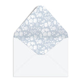 Elevate your correspondence with the Liberty Premium Notecard Set. This elegant collection features 16 folded notecards showcasing 8 distinctive iconic Liberty London designs. Each card is finished with delicate die-cut scalloped edges that add a refined touch to every note you send. The set includes full-color envelopes lined with charming floral patterns, bringing beauty to every detail. Presented in a premium drawer box with a sturdy ribbon pull, this notecard set makes a sophisticated gift or a treasure