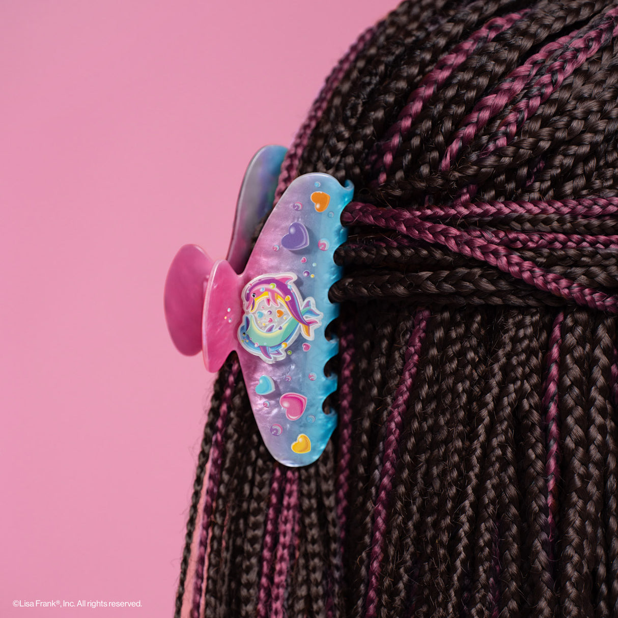 Add a refreshing touch to your style inspired by Lisa Frank® funny Dancing Dolphins™

Create an easy half-up do or clip your hair all the way up and back. Perfect for every day and elevating your everyday look!