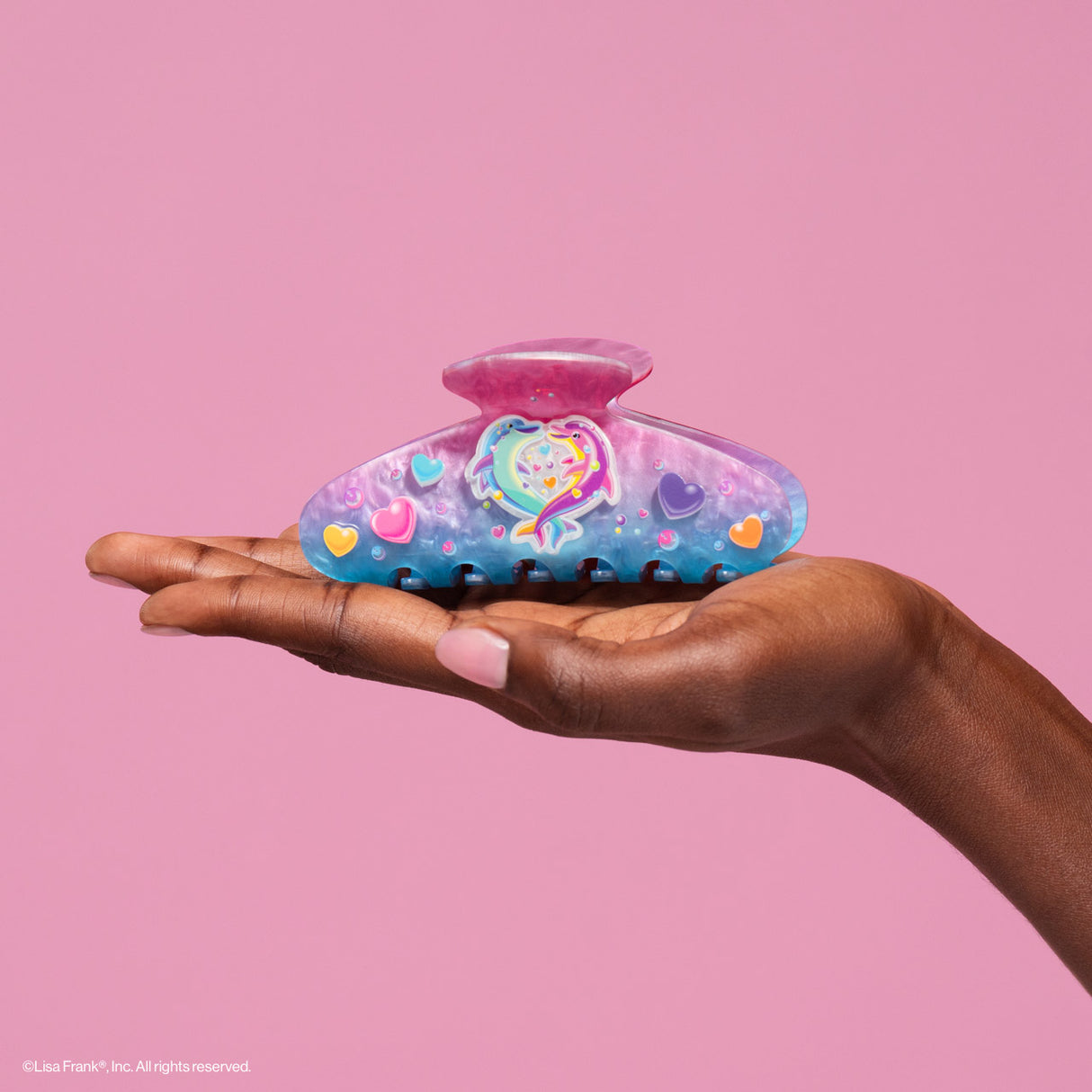 Add a refreshing touch to your style inspired by Lisa Frank® funny Dancing Dolphins™

Create an easy half-up do or clip your hair all the way up and back. Perfect for every day and elevating your everyday look!