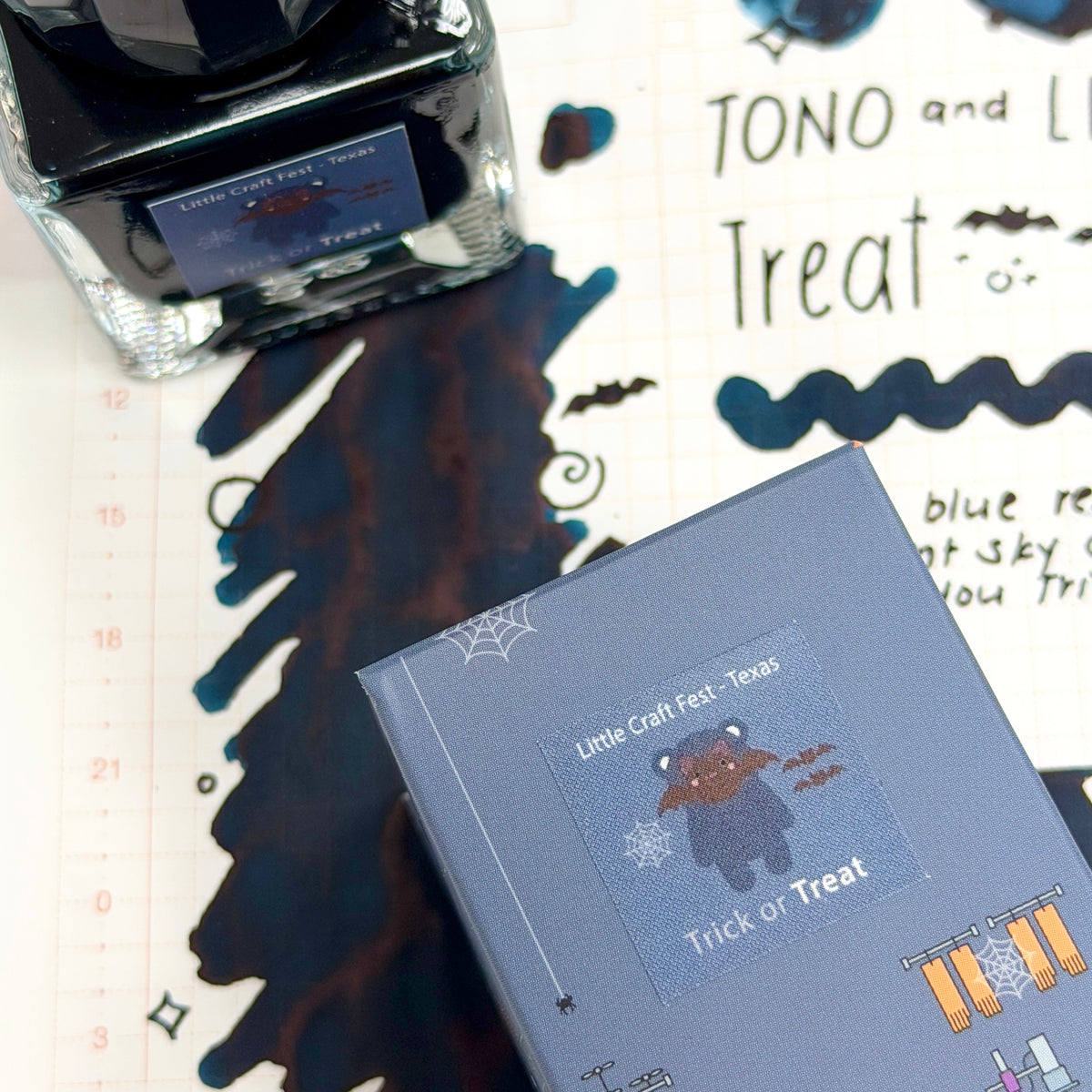 A cool stormy slate base is illuminated by bright cerulean highlights and warm rosy undertones that appear where the ink pools and shades. The result is a wonderfully dynamic color that shifts between soft and striking, capturing the excitement of a Halloween haul filled with favorite finds. Charming, versatile, and full of character, Treat brings a touch of delight to every page.

