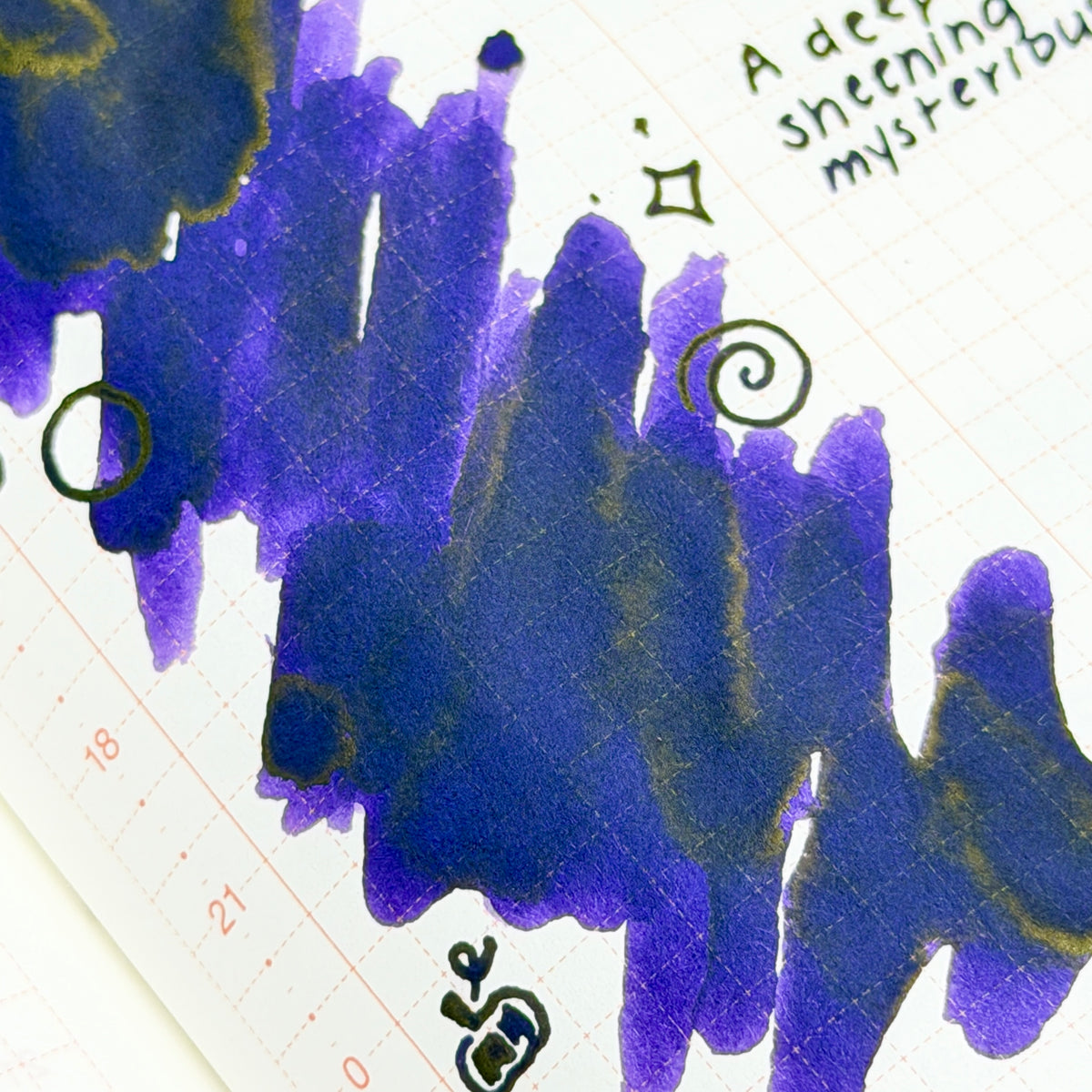 Trick is a mysterious purple that keeps its secrets well. Deep violet and midnight indigo mingle across the page, while earthy olive undertones emerge in concentrated areas, creating an intriguing color shift with every stroke. Rich shading adds depth and drama, evoking moonlit paths, hidden doorways, and Halloween mischief waiting just around the corner. Elegant, moody, and delightfully unpredictable, this is an ink for those who enjoy a little mystery.
