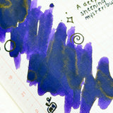 Trick is a mysterious purple that keeps its secrets well. Deep violet and midnight indigo mingle across the page, while earthy olive undertones emerge in concentrated areas, creating an intriguing color shift with every stroke. Rich shading adds depth and drama, evoking moonlit paths, hidden doorways, and Halloween mischief waiting just around the corner. Elegant, moody, and delightfully unpredictable, this is an ink for those who enjoy a little mystery.
