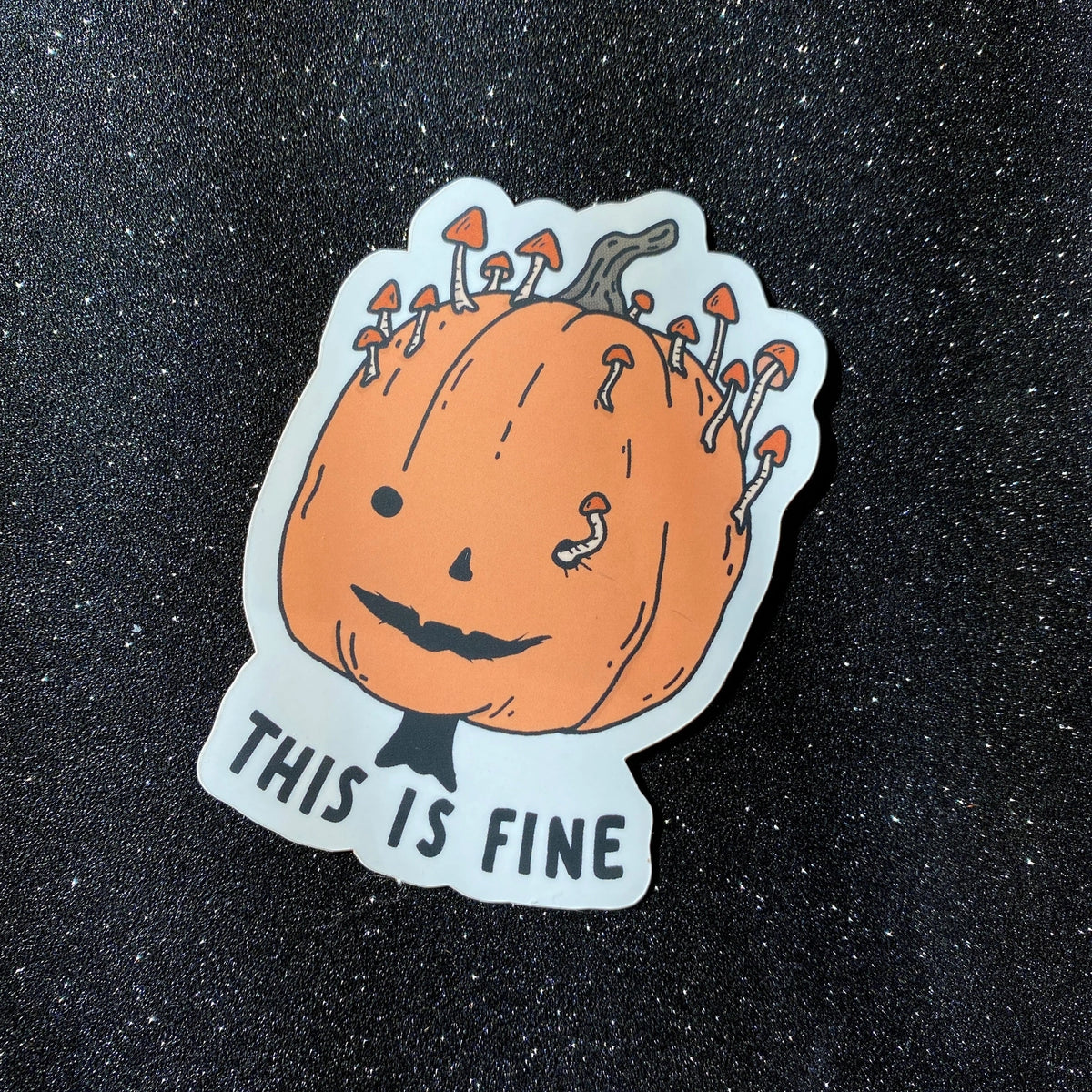 Little Spooky Studio - This Is Fine Pumpkin Vinyl Sticker

3 inch matte sticker of a rotting mushroomy pumpkin with the text "This is fine." underneath.