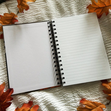 A new A5 notebook featuring a ghost dressing up as a witch!

This hardcover notebook comes lined and with an elastic band. There are 96 double sided pages.